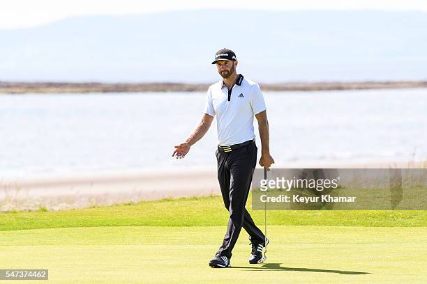 Dustin Johnson of the United States reacts to missing a birdie putt on the fifth hole green during the first round on day one of the 145th Open...