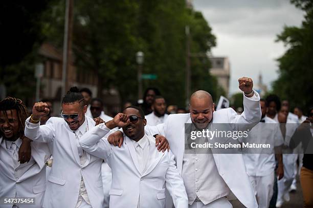 Pallbearers lead a march down Selby Avenue after the funeral of Philando Castile at the Cathedral of St. Paul on July 14, 2016 in St. Paul,...