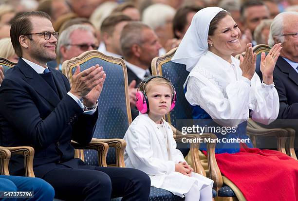 Crown Princess Victoria of Sweden and Prince Daniel, Duke of Vastergotland with Princess Estelle of Sweden attend a concert at the 39th birthday...