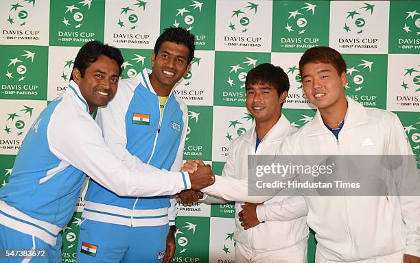 Indian Tennis players Rohan Bopanna and Leander Paes meeting Korea players Hong Chung and Yungseon Chung after the draw ceremony of Davis Cup between...