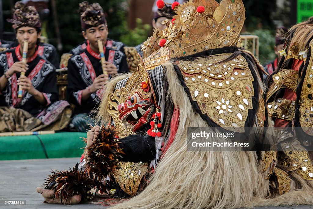 Artists perform in Balinese Barong masks during the Festival...