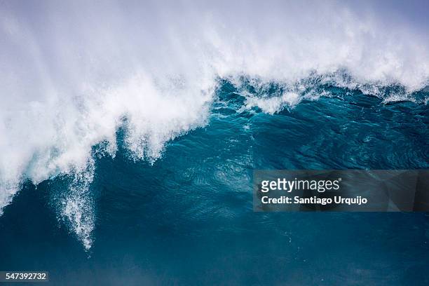 big wave crashing with spray blowing up on the air - big wave stock pictures, royalty-free photos & images