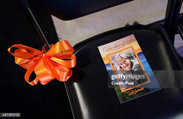 Program sits on a chair in Thompson-Boling Arena before a ceremony to celebrate the life of former Tennessee women's basketball coach Pat Summitt on...