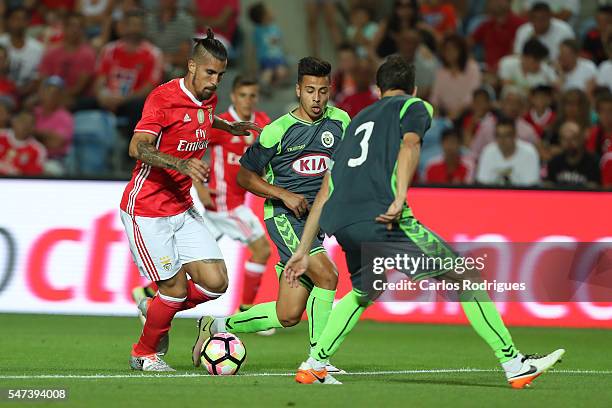 Benfica's forward Oscar Benitez tries to escape Setubal's defender Frederico Venancio during the Pre Season match between SL Benfica and Vitoria...