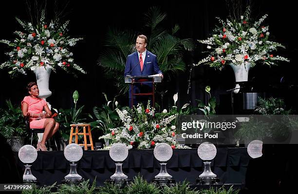 Former NFL and University of Tennessee quarterback Peyton Manning speaks as emcee Robin Roberts looks on during a ceremony to celebrate the life of...