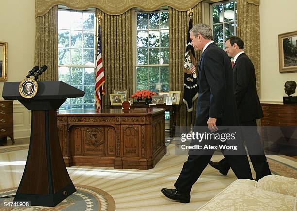 President George W. Bush and Supreme Court nominee John G. Roberts walk toward a podium prior to an announcement at the Oval Office of the White...