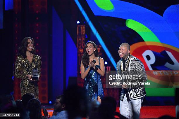 Singer Farruko recieves award onstage at the Univision's 13th Edition Of Premios Juventud Youth Awards at Bank United Center on July 14, 2016 in...