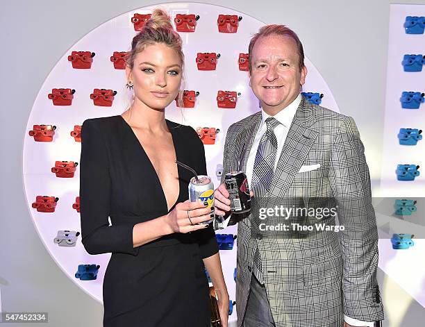 Model Martha Hunt and President, Global Beverage Group, PepsiCo Brad Jakeman attend the opening party and celebration of LOVE: From Cave to Keyboard,...