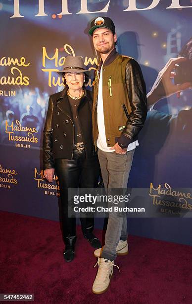 Jimi Blue Ochsenknecht and Baerbel Wierichs attends the unveiling of the Calvin Harris wax figure at Madame Tussauds on July 14, 2016 in Berlin,...