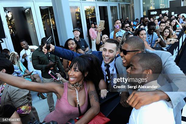 Omar Benson Miller and Dule Hill pose with fans at the HBO Ballers Season 2 Red Carpet Premiere and Reception on July 14, 2016 at New World Symphony...