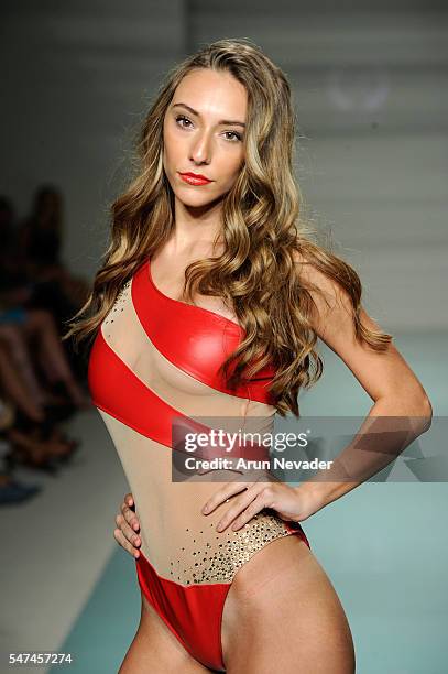 Models walk the runway at Cirone Swim Runway Show during Art Hearts Fashion Miami Swim Week Presented by AIDS Healthcare Foundation at Collins Park...