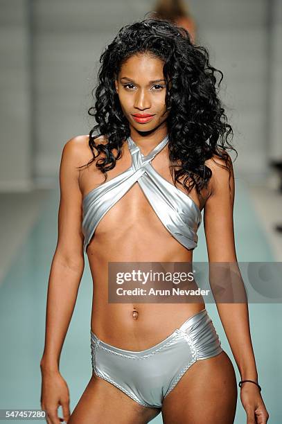 Models walk the runway at Cirone Swim Runway Show during Art Hearts Fashion Miami Swim Week Presented by AIDS Healthcare Foundation at Collins Park...