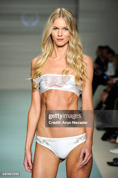 Models walk the runway at Cirone Swim Runway Show during Art Hearts Fashion Miami Swim Week Presented by AIDS Healthcare Foundation at Collins Park...