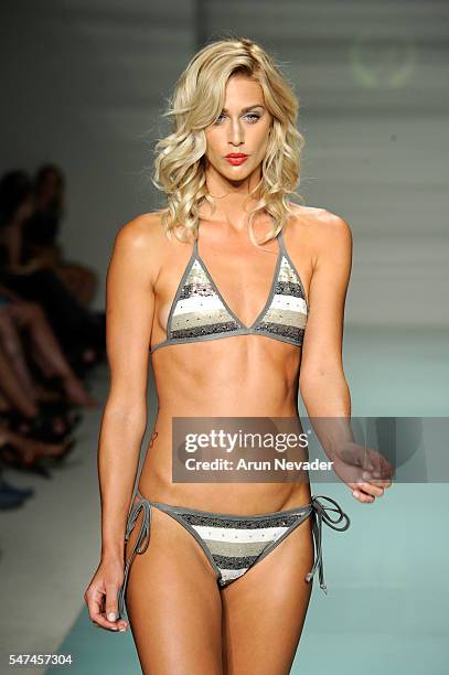 Models walk the runway at Cirone Swim Runway Show during Art Hearts Fashion Miami Swim Week Presented by AIDS Healthcare Foundation at Collins Park...