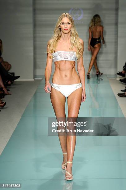 Models walk the runway at Cirone Swim Runway Show during Art Hearts Fashion Miami Swim Week Presented by AIDS Healthcare Foundation at Collins Park...