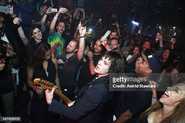 Musician Tyler Bryant of Tyler Bryan & The Shakedown performs in the crowd during the John Varvatos Spring/Summer 2017 Fashion Show after party...
