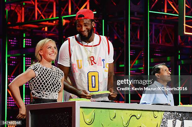 Professional snowboarder Jamie Anderson, NBA player Andre Drummond, and jockey Victor Espinoza participate in a key slime pie eating contest onstage...