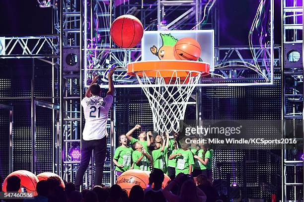 Player Stephen Curry shoots baskets onstage during the Nickelodeon Kids' Choice Sports Awards 2016 at UCLA's Pauley Pavilion on July 14, 2016 in...