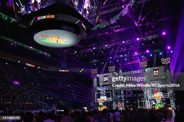 Player Stephen Curry shoots baskets onstage during the Nickelodeon Kids' Choice Sports Awards 2016 at UCLA's Pauley Pavilion on July 14, 2016 in...