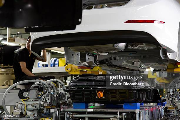 Battery pack for a Hyundai Motor Co. Ioniq electric vehicle sits on the production line at the company's plant in Ulsan, South Korea, on Monday, July...