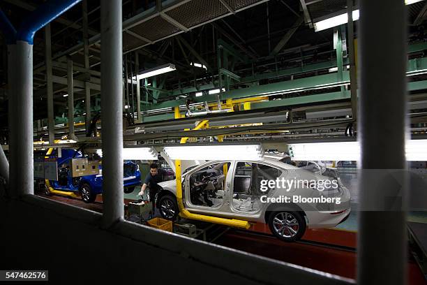 An employee assembles a Hyundai Motor Co. Elantra vehicle on the production line at the company's plant in Ulsan, South Korea, on Monday, July 4,...