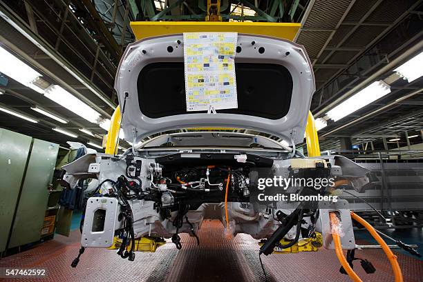 Conveyor moves a Hyundai Motor Co. Ioniq electric vehicle on the production line at the company's plant in Ulsan, South Korea, on Monday, July 4,...