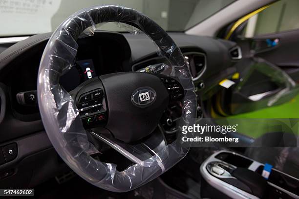Steering wheel is seen in a Hyundai Motor Co. Ioniq electric vehicle on the production line at the company's plant in Ulsan, South Korea, on Monday,...