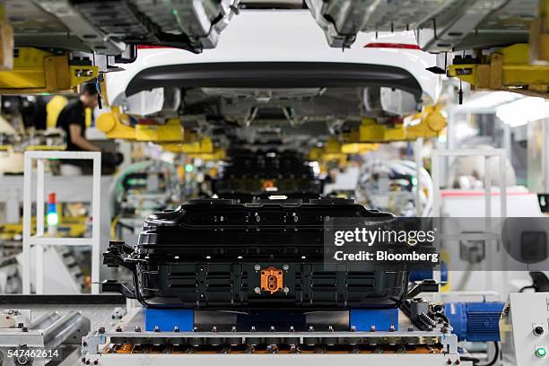 Battery packs for the Hyundai Motor Co. Ioniq electric vehicle sit on the production line at the company's plant in Ulsan, South Korea, on Monday,...