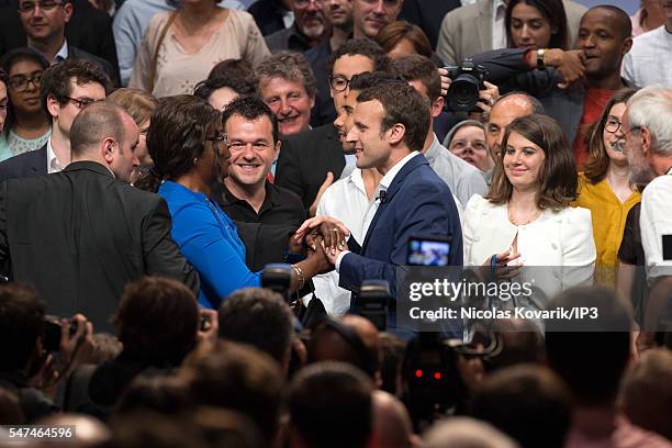 French Minister of Economy, Emmanuel Macron shakes hands of one of the 3000 partisans come to the first meeting of his political movement titled 'En...