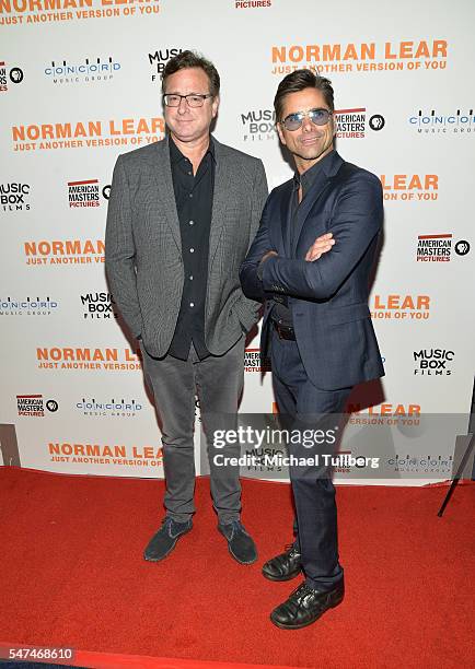 Actors Bob Saget and John Stamos attend the premiere of Music Box Films' "Norman Lear: Just Another Version Of You" at The WGA Theater on July 14,...
