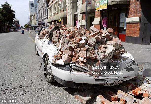 New Zealand - A car wrecked by falling bricks in a major earthquake on Feb. 22 is left abandoned in Christchurch, New Zealand, on Feb. 28.