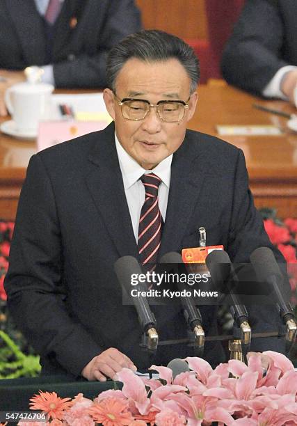 China - Wu Bangguo, chairman of the Standing Committee of China's National People's Congress, delivers a committee work report during an NPC plenary...