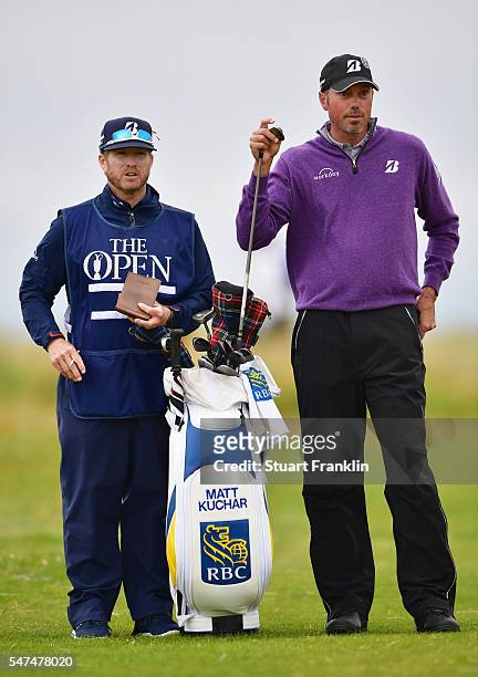Matt Kuchar of the United States looks on next to his caddie John Wood on the 3rd during the second round on day two of the 145th Open Championship...