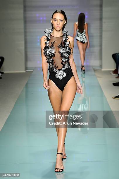 Model walks the runway at Rocky Gathercole Runway Show during Art Hearts Fashion Miami Swim Week Presented by AIDS Healthcare Foundation at Collins...