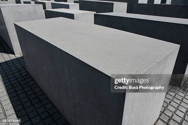 "memorial to the murdered jews of europe", designed by architect peter eisenman near the brandenburg gate, architectural detail of the grid pattern of concrete slabs - holocaust victims stock pictures, royalty-free photos & images