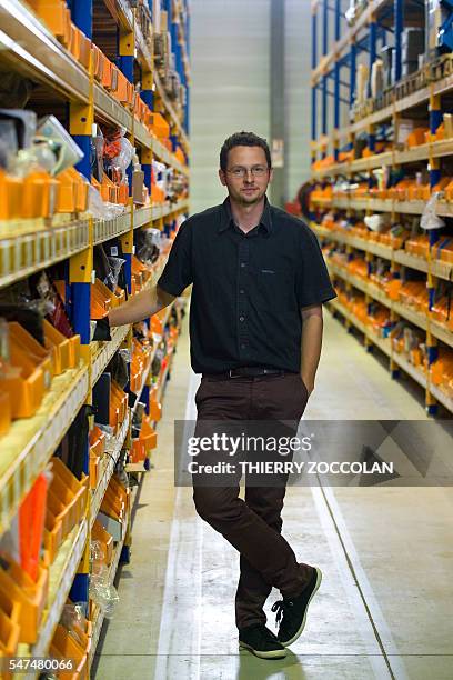 Faustin Falcon, CEO of the Pecheur.com company, leader in the sale of fishing equipment on internet, poses at his company's headquarters in Gannat on...