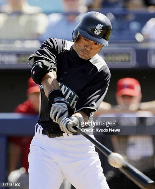 United States - Seattle Mariners outfielder Ichiro Suzuki hits a single in the first inning of a game against the Los Angeles Angels in Peoria,...