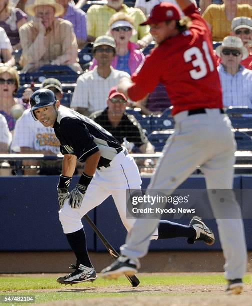 United States - Seattle Mariners outfielder Ichiro Suzuki hits a single in the fourth inning of a game against the Los Angeles Angels in Peoria,...