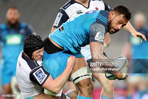 Patrick Tuipulotu of the Blues is tackled by Paddy Ryan of the Waratahs during the round 17 Super Rugby match between the Blues and the Waratahs at...