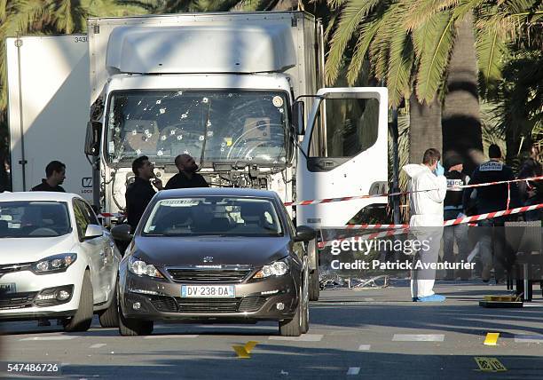 Forensic police investigate a truck at the scene of a terror attack on the Promenade des Anglais on July 15, 2016 in Nice, France. A French-Tunisian...
