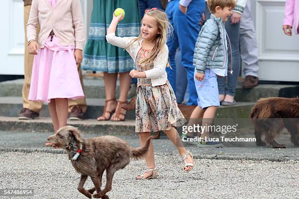 Princess Josephine of Denmark throws a ball for a dog the annual summer photo call for The Danish Royal Family at Grasten Castle on July 15, 2016 in...