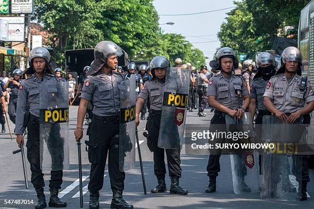 Hunderds of Indonesian police surround a Papuan student dormitory in Yogyakarta on July 15 to prevent the students from holding a planned protest...