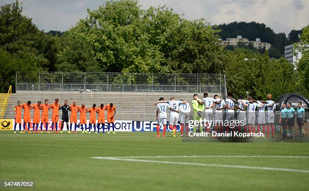 The teams hold a minutes silence for the victims of Nice terror attack prior to the UEFA Under19 European Championship match between U19 Netherlands...