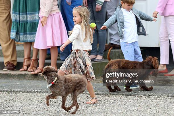 Princess Josephine of Denmark throws a ball for a dog during the annual summer photo call for The Danish Royal Family at Grasten Castle on July 15,...