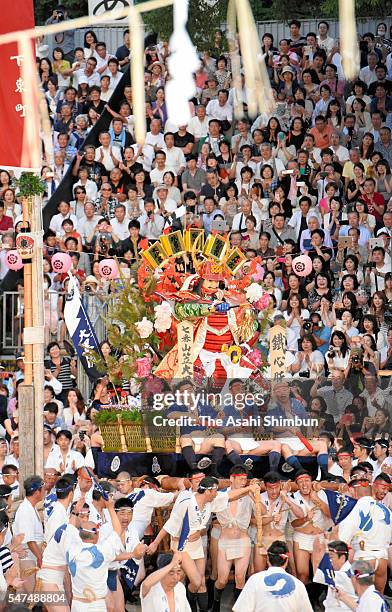 The seventh float 'Daikoku Nagare' rushes through Seido Street of Kushida Jinja Shrine during the Hakata Gion Yamakasa festival on July 15, 2016 in...