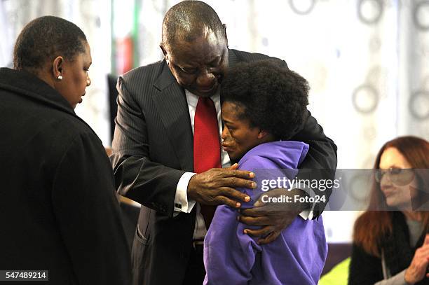 Deputy President Cyril Ramaphosa hugs Mpho Bagaqane during his visit at Nkosis Haven on July 13, 2016 in Johannesburg, South Africa. Ramaphosa...