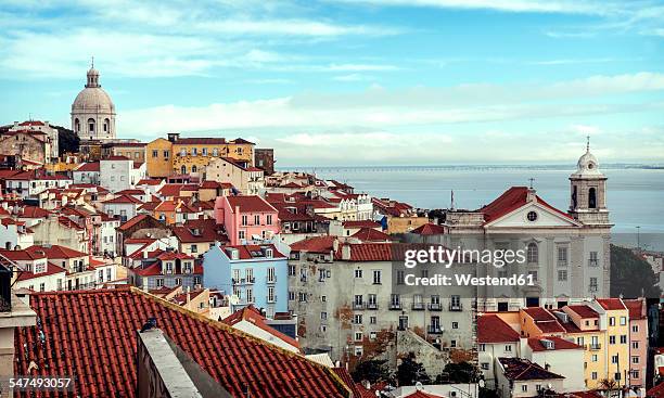 portugal, lisbon, view of alfama neighborhood - lissabon stock-fotos und bilder