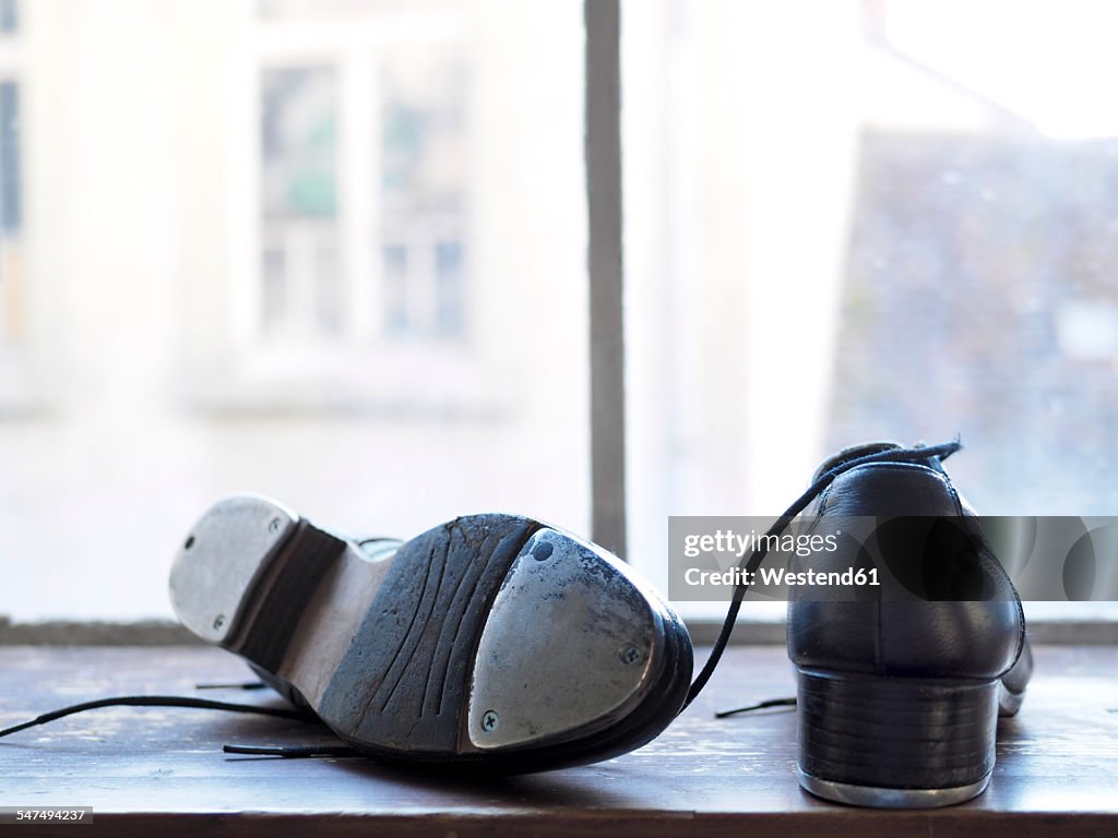 Step dancing shoes on a window sill