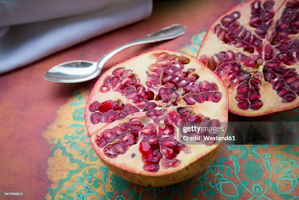 Two halves of a pomegranate