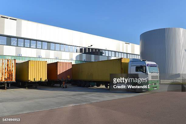 truck at a loading bay - delivery truck stock-fotos und bilder